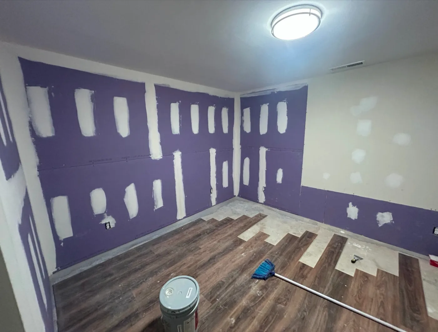 Finished interior room remodel with new flooring and walls